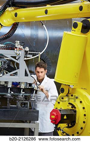 Stock Photograph - Research and development for the design of robotic manufacturing cell to work in aircraft component. Industry and Transport. Research & innovation.. Fotosearch