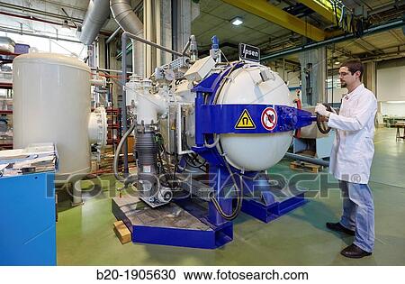 Stock Image - Researcher, High vacuum furnace for realization of braised joints, Industry, Tecnalia Research & innovation, Technology and Research Centre, Miramon Technological Park, San Sebastian, Donostia, Gipuzkoa, Basque Country, Spain. Fotosearch