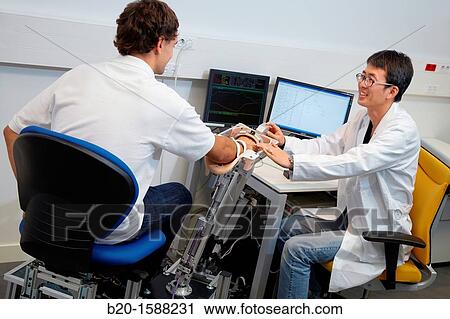 Researcher placing a patient clinical training device of the limb has multiple modes of training wrist and arm View Large Photo Image Stock Image - Researcher placing a patient clinical training device of the limb has multiple modes of training wrist and arm. Fotosearch