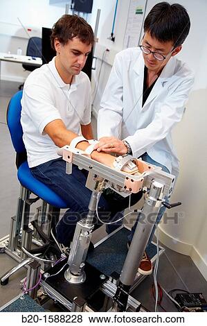 Researcher placing a patient clinical training device of the limb has multiple modes of training wrist and arm View Large Photo Image Stock Photo - Researcher placing a patient clinical training device of the limb has multiple modes of training wrist and arm. Fotosearch
