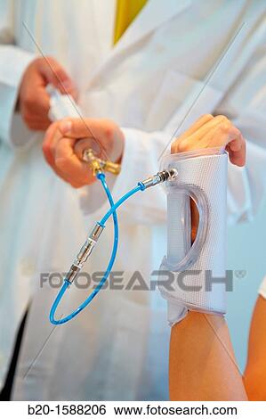 Researcher placing a patient splint prototype built with variable stiffness textile and automatic generation by vacuum lamination View Large Photo Image Stock Photograph - Researcher placing a patient splint prototype built with variable stiffness textile and automatic generation by vacuum lamination. Fotosearch