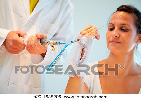 Researcher placing a patient splint prototype built with variable stiffness textile and automatic generation by vacuum lamination View Large Photo Image Stock Photography - Researcher placing a patient splint prototype built with variable stiffness textile and automatic generation by vacuum lamination. Fotosearch