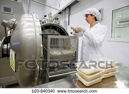 Stock Image - Researcher setting prepared food in autoclave to pasteurize, pilot plant, AZTI-Tecnalia, Technology Centre for Marine and Food Research, Derio, Biscay, Basque Country, Spain. Fotosearch