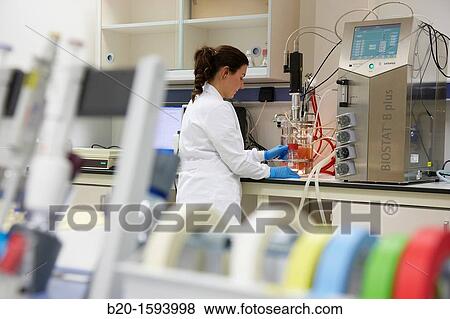 Researcher taking a sample of carotenoid-producing yeast obtained by continued growth in the bioreactor View Large Photo Image Stock Photo - Researcher taking a sample of carotenoid-producing yeast obtained by continued growth in the bioreactor. Fotosearch