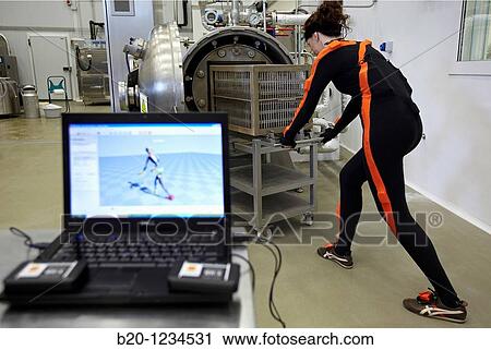 Stock Image - Researcher wearing a full body suit? Ergomoven? designed specifically for human motion capture, AZTI-Tecnalia Marine and Food Research Center pilot plant, Derio, Bizkaia, Euskadi, Spain. Fotosearch