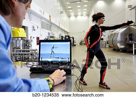 Stock Photography - Researcher wearing a full body suit? Ergomoven? designed specifically for human motion capture, AZTI-Tecnalia Marine and Food Research Center pilot plant, Derio, Bizkaia, Euskadi, Spain. Fotosearch