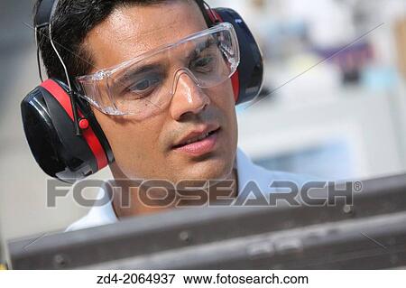 Researcher with glasses and ear protection. View Large Photo Image Stock Photo - Researcher with glasses and ear protection.. Fotosearch