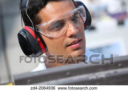 Researcher with glasses and ear protection. View Large Photo Image Stock Photograph - Researcher with glasses and ear protection.. Fotosearch