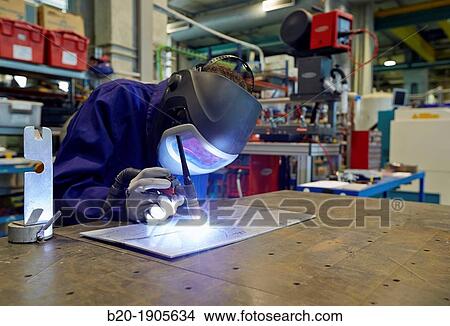 Picture - Researcher with TIG welding equipment, making joints by electrical arc, Industry, Tecnalia Research & innovation, Technology and Research Centre, Miramon Technological Park, San Sebastian, Donostia, Gipuzkoa, Basque Country, Spain. Fotosearch