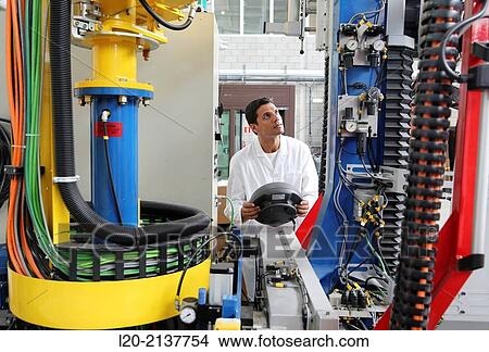 Researcher working on portable robot. Aerospace industry. Technology and Research Center. Miramon Technological Park. San Sebastian. Donostia. Gipuzkoa. Basque Country. Spain. View Large Photo Image Picture - Researcher working on portable robot. Aerospace industry. Technology and Research Center. Miramon Technological Park. San Sebastian. Donostia. Gipuzkoa. Basque Country. Spain.. Fotosearch