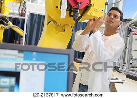 Researcher working on portable robot. Aerospace industry. Technology and Research Center. Miramon Technological Park. San Sebastian. Donostia. Gipuzkoa. Basque Country. Spain. View Large Photo Image Stock Photo - Researcher working on portable robot. Aerospace industry. Technology and Research Center. Miramon Technological Park. San Sebastian. Donostia. Gipuzkoa. Basque Country. Spain.. Fotosearch