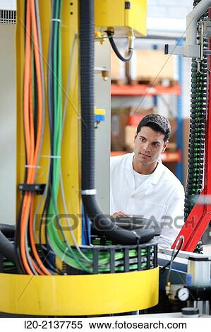 Researcher working on portable robot. Aerospace industry. Technology and Research Center. Miramon Technological Park. San Sebastian. Donostia. Gipuzkoa. Basque Country. Spain. View Large Photo Image Stock Photography - Researcher working on portable robot. Aerospace industry. Technology and Research Center. Miramon Technological Park. San Sebastian. Donostia. Gipuzkoa. Basque Country. Spain.. Fotosearch