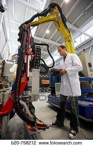 Researcher working on Roptalmu portable robot to drill holes into aircraft components, Fatronik-Tecnalia, Research and Technology Center, Donostia, Basque Country, Spain View Large Photo Image Stock Image - Researcher working on Roptalmu portable robot to drill holes into aircraft components, Fatronik-Tecnalia, Research and Technology Center, Donostia, Basque Country, Spain. Fotosearch