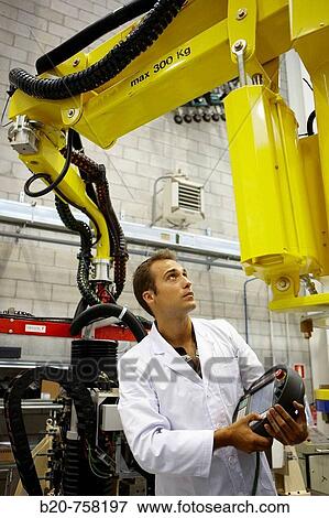 Stock Photo - Researcher working on Roptalmu portable robot to drill holes into aircraft components, Fatronik-Tecnalia, Research and Technology Center, Donostia, Basque Country, Spain. Fotosearch