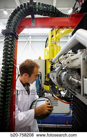 Researcher working on Roptalmu portable robot to drill holes into aircraft components, Fatronik-Tecnalia, Research and Technology Center, Donostia, Basque Country, Spain View Large Photo Image Stock Photo - Researcher working on Roptalmu portable robot to drill holes into aircraft components, Fatronik-Tecnalia, Research and Technology Center, Donostia, Basque Country, Spain. Fotosearch