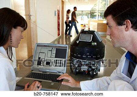 Stock Photo - Researchers demonstrating a robot autonomous navigation capability using environment representation, Fatronik-Tecnalia, Research and Technology Center, Donostia, Basque Country, Spain. Fotosearch