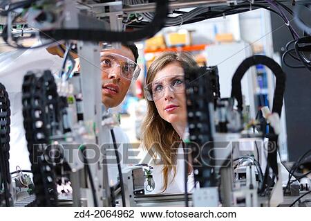 Researchers. Industrial Robot System. Tecnacomp Robotic cell manufacturing composite preforms Dry fiber preform manufacturing 3D Industry. View Large Photo Image Stock Image - Researchers. Industrial Robot System. Tecnacomp Robotic cell manufacturing composite preforms Dry fiber preform manufacturing 3D Industry.. Fotosearch