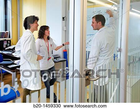 Stock Image - Researchers? meeting, offices, Biodonostia Health and Biomedicine Research Institute, San Sebastian, Donostia, Gipuzkoa, Euskadi, Spain. Fotosearch