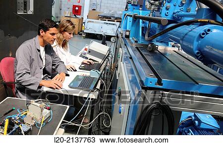 Stock Image - Researchers. Prototype test bench for the development of electromechanical linear actuators for the aerospace industry. Technology and Research Center. Technological Park. San Sebastian. Donostia. Gipuzkoa. Basque Country. Spain.. Fotosearch