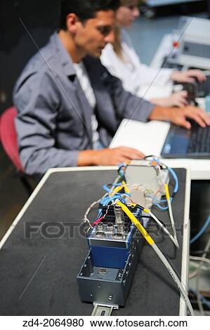 Researchers. Prototype test bench for the development of electromechanical linear actuators for the aerospace industry. View Large Photo Image Stock Image - Researchers. Prototype test bench for the development of electromechanical linear actuators for the aerospace industry.. Fotosearch