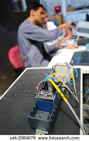 Researchers. Prototype test bench for the development of electromechanical linear actuators for the aerospace industry. View Large Photo Image Stock Photo - Researchers. Prototype test bench for the development of electromechanical linear actuators for the aerospace industry.. Fotosearch