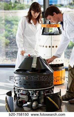 Researchers testing MiReLa guiding robot, Pioneer and Mugiro multipurpose mobile platforms in non-controlled environment with obstacles and moving people, Fatronik-Tecnalia, Research and Technology Center, Donostia, Basque Country, Spain View Large Photo Image Stock Image - Researchers testing MiReLa guiding robot, Pioneer and Mugiro multipurpose mobile platforms in non-controlled environment with obstacles and moving people, Fatronik-Tecnalia, Research and Technology Center, Donostia, Basque Country, Spain. Fotosearch
