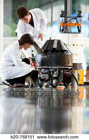 Researchers testing MiReLa guiding robot, Pioneer and Mugiro multipurpose mobile platforms in non-controlled environment with obstacles and moving people, Fatronik-Tecnalia, Research and Technology Center, Donostia, Basque Country, Spain View Large Photo Image Stock Image - Researchers testing MiReLa guiding robot, Pioneer and Mugiro multipurpose mobile platforms in non-controlled environment with obstacles and moving people, Fatronik-Tecnalia, Research and Technology Center, Donostia, Basque Country, Spain. Fotosearch