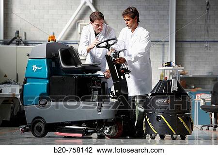 Stock Image - Researchers testing Mugiro multipurpose mobile platform developed by Fatronik-Tecnalia, Research and Technology Center, Donostia, Basque Country, Spain. Fotosearch