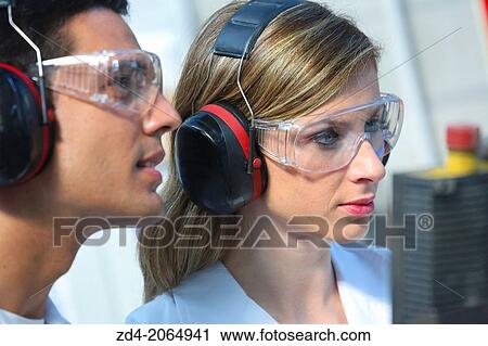 Researchers with glasses and ear protection. View Large Photo Image Stock Image - Researchers with glasses and ear protection.. Fotosearch