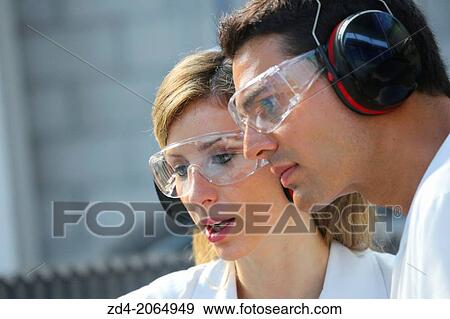 Researchers with glasses and ear protection. View Large Photo Image Stock Photo - Researchers with glasses and ear protection.. Fotosearch