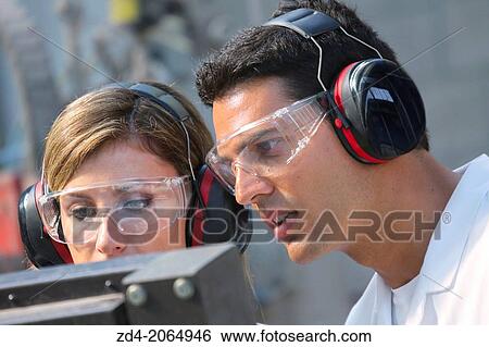 Researchers with glasses and ear protection. View Large Photo Image Stock Photograph - Researchers with glasses and ear protection.. Fotosearch