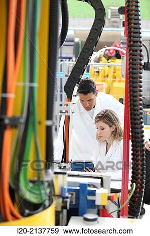 Researchers working on portable robot. Aerospace industry. Technology and Research Center. Miramon Technological Park. San Sebastian. Donostia. Gipuzkoa. Basque Country. Spain. View Large Photo Image Stock Photo - Researchers working on portable robot. Aerospace industry. Technology and Research Center. Miramon Technological Park. San Sebastian. Donostia. Gipuzkoa. Basque Country. Spain.. Fotosearch
