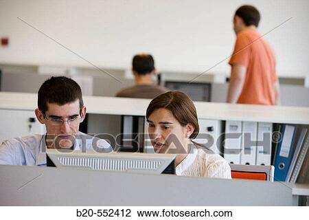 Stock Image - Researchers working with PCs. Fatronik Foundation, Research Technology Center. Donostia, San Sebastian, Gipuzkoa, Euskadi. Spain.. Fotosearch