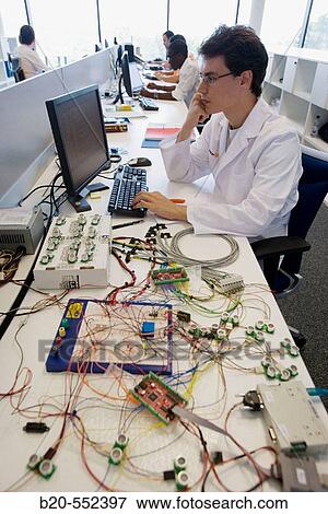 Stock Photo - Resercher working with sensors. Project Mugiro. Fatronik Foundation, Research Technology Center. Donostia, San Sebastian, Gipuzkoa, Euskadi. Spain.. Fotosearch