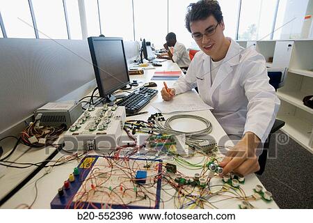 Resercher working with sensors. Project Mugiro. Fatronik Foundation, Research Technology Center. Donostia, San Sebastian, Gipuzkoa, Euskadi. Spain. View Large Photo Image Stock Photograph - Resercher working with sensors. Project Mugiro. Fatronik Foundation, Research Technology Center. Donostia, San Sebastian, Gipuzkoa, Euskadi. Spain.. Fotosearch