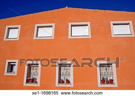 residential building, Cervera, houses, windows, shutters, fences, planters, asymmetric, blue sky, architectural, color, horizontal View Large Photo Image Stock Photography - residential building, Cervera, houses, windows, shutters, fences, planters, asymmetric, blue sky, architectural, color, horizontal. Fotosearch