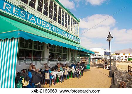 Stock Photo - Restaurant, Avenida Maritima seaside promenade, Playa Blanca, Lanzarote, Canary Islands, Spain, Europe.. Fotosearch