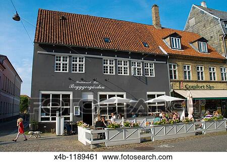Stock Image - Restaurant terrace along Algade main pedestrian street Roskilde Denmark Europe. Fotosearch