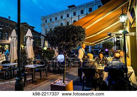 Stock Photo - restaurante al anochecer, plaza Vecchia, ciudad alta, Bergamo, Lombardia, Italia, Europa.. Fotosearch