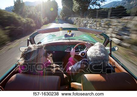Retired couple driving their Classic 1959 Porsche 356A Cabriolet View Large Photo Image Stock Photo - Retired couple driving their Classic 1959 Porsche 356A Cabriolet. Fotosearch