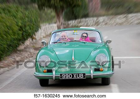 Retired couple driving their Classic 1959 Porsche 356A Cabriolet View Large Photo Image Stock Photography - Retired couple driving their Classic 1959 Porsche 356A Cabriolet. Fotosearch