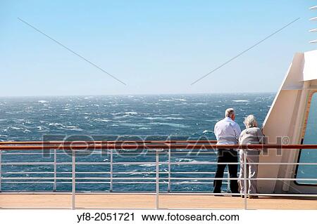 Retired couple on the deck of a cruise ship. View Large Photo Image Stock Image - Retired couple on the deck of a cruise ship.. Fotosearch