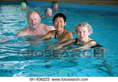 Retired German couple with their Chinese daughter in law in a public swimming pool View Large Photo Image Stock Image - Retired German couple with their Chinese daughter in law in a public swimming pool. Fotosearch