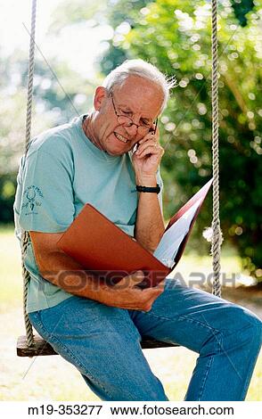retired man checking investments View Large Photo Image Stock Photo - retired man checking investments. Fotosearch