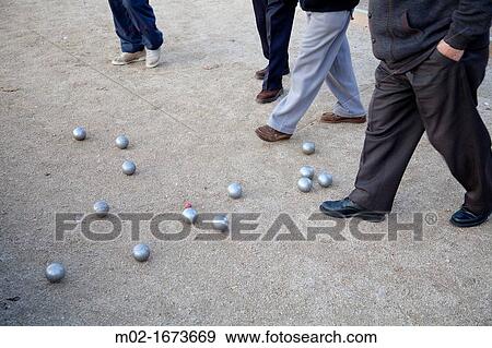 Stock Photo - Retired playing Petanca in Madrid Rio park, Madrid, Spain Madrid Rio is the last great ecological development in the city. Fotosearch