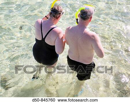 Retired tourist couple snorkeling on the beach. Sharm el-Sheikh, Egypt View Large Photo Image Stock Image - Retired tourist couple snorkeling on the beach. Sharm el-Sheikh, Egypt. Fotosearch