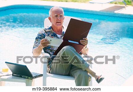 retiree checking finances View Large Photo Image Picture - retiree checking finances. Fotosearch