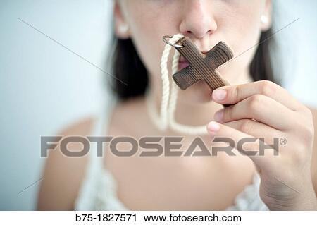 retrato de joven religiosa besando una cruz, portrait of young nun kissing a cross, View Large Photo Image Stock Image - retrato de joven religiosa besando una cruz, portrait of young nun kissing a cross,. Fotosearch
