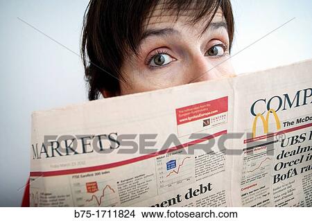 Retrato de mujer de pelo moreno y ojos verdes con periodico economico, Portrait of brown-haired woman with green eyes and economic newspaper View Large Photo Image Picture - Retrato de mujer de pelo moreno y ojos verdes con periodico economico, Portrait of brown-haired woman with green eyes and economic newspaper. Fotosearch