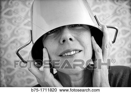 Retrato de mujer de pelo moreno y ojos verdes con una olla en la cabeza, Portrait of brown-haired woman with green eyes and a pot on his head, View Large Photo Image Stock Image - Retrato de mujer de pelo moreno y ojos verdes con una olla en la cabeza, Portrait of brown-haired woman with green eyes and a pot on his head,. Fotosearch